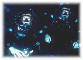 Photo shows JJ (on the right) and buddy in Cayman cavern